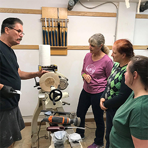 ladies learning to use a lathe