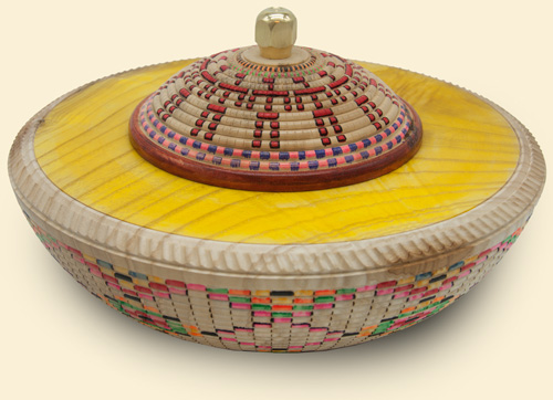 a multi-color, lidded bowl with a bright yellow top